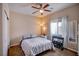 Bedroom with a ceiling fan, a queen sized bed, and closet storage at 1699 Sonoran Bluff Ave, Henderson, NV 89014