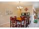 Inviting dining area features a classic table, decorative lighting, and tiled flooring at 1699 Sonoran Bluff Ave, Henderson, NV 89014