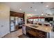 Kitchen with stainless appliances and sink island that opens to the living room at 1699 Sonoran Bluff Ave, Henderson, NV 89014