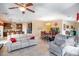 Open concept living room with dining area and view of the kitchen at 1699 Sonoran Bluff Ave, Henderson, NV 89014