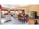 Open-concept design featuring dining and living areas with tiled flooring, bathed in natural light at 1699 Sonoran Bluff Ave, Henderson, NV 89014