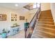 Staircase leading to the upper level, with carpeted steps and wrought iron railing at 1699 Sonoran Bluff Ave, Henderson, NV 89014