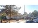 Classic single-story house featuring a quaint facade, mature trees, and a welcoming entrance at 2020 Peyton Dr, Las Vegas, NV 89104