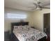 Bedroom featuring carpeted floors, a ceiling fan, a window, and a full sized bed at 2108 Willowbury Dr # B, Las Vegas, NV 89108
