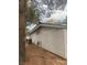 Exterior view of a home featuring textured walls, an air conditioning unit and gravel landscaping at 2108 Willowbury Dr # B, Las Vegas, NV 89108