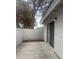 Back patio area that includes a sliding glass door and exterior textured walls at 2108 Willowbury Dr # B, Las Vegas, NV 89108