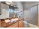 Bathroom featuring a vanity with granite countertops and a mirror with modern lighting at 2111 Bogart Ct, Las Vegas, NV 89117