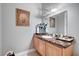 Elegant bathroom with a marble countertop and a decorative mirror, creating a luxurious space at 2111 Bogart Ct, Las Vegas, NV 89117