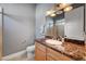 Bathroom featuring a vanity with marble countertop and shower and sink fixture at 2111 Bogart Ct, Las Vegas, NV 89117