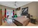 Bedroom featuring modern ceiling fan and access to a private outdoor area at 2111 Bogart Ct, Las Vegas, NV 89117