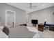 Bedroom featuring a spacious layout with bed, desk area, and sleek TV setup at 2111 Bogart Ct, Las Vegas, NV 89117