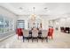 Well-lit dining room with a long table and comfortable seating arrangement at 2111 Bogart Ct, Las Vegas, NV 89117