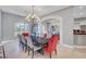 Bright dining room featuring a modern chandelier, table, and large window at 2111 Bogart Ct, Las Vegas, NV 89117