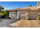 Spacious three car garage with neutral doors on a home with a private driveway at 2111 Bogart Ct, Las Vegas, NV 89117