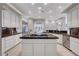 Open kitchen with stainless steel appliances and a center island with a built-in cooktop at 2111 Bogart Ct, Las Vegas, NV 89117