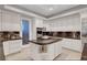 Bright kitchen with a center island cooktop and stainless steel appliances for a chef-inspired experience at 2111 Bogart Ct, Las Vegas, NV 89117
