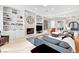 Spacious living room featuring a fireplace, built-in shelves, and ample seating at 2111 Bogart Ct, Las Vegas, NV 89117