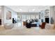 Spacious living room boasts marble floors, bright skylights, and an entertainment center with a cozy fireplace at 2111 Bogart Ct, Las Vegas, NV 89117
