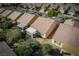 Aerial view of homes with patios and desert landscaping, capturing a well-planned residential community at 2708 Cheer Pheasant Ave, North Las Vegas, NV 89084