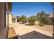 Landscaped backyard featuring a stone pathway, well-manicured shrubbery, gravel, and a serene outdoor space at 2708 Cheer Pheasant Ave, North Las Vegas, NV 89084