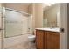 Bathroom featuring a shower over tub and wood cabinets at 2708 Cheer Pheasant Ave, North Las Vegas, NV 89084