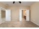 Spacious bedroom showcasing neutral tones and access to the bathroom and closet at 2708 Cheer Pheasant Ave, North Las Vegas, NV 89084