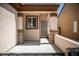 Welcoming front porch with brick pillars, security door, and neutral color palette at 2708 Cheer Pheasant Ave, North Las Vegas, NV 89084