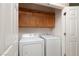 Convenient laundry room features a washer, dryer, and storage cabinets at 2708 Cheer Pheasant Ave, North Las Vegas, NV 89084
