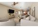 Bright living room featuring comfortable seating, neutral décor, and seamless access to the adjacent kitchen at 2708 Cheer Pheasant Ave, North Las Vegas, NV 89084