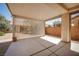 Covered patio with a privacy screen, concrete flooring, and access to the home's exterior at 2708 Cheer Pheasant Ave, North Las Vegas, NV 89084
