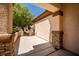 Covered porch with stone accents, offering a shady spot with views of the landscaped front yard and neighborhood at 2708 Cheer Pheasant Ave, North Las Vegas, NV 89084