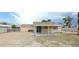 Expansive backyard with covered patio, perfect for outdoor entertaining and relaxation at 275 Las Palmaritas Dr, Las Vegas, NV 89110