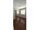 Bedroom features laminate flooring, a window with horizontal blinds, and a closet with sliding mirror doors at 275 Las Palmaritas Dr, Las Vegas, NV 89110