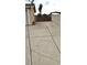 Long driveway leading to a gated backyard at 275 Las Palmaritas Dr, Las Vegas, NV 89110