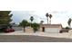Charming single-story home with a two-car garage, mature trees, and low maintenance landscaping at 275 Las Palmaritas Dr, Las Vegas, NV 89110