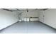 The well-lit garage features laundry hookups and extra storage cabinets at 275 Las Palmaritas Dr, Las Vegas, NV 89110