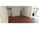 Open-concept living area with wood floors connecting to the kitchen at 275 Las Palmaritas Dr, Las Vegas, NV 89110