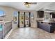 Bright breakfast nook with bar seating and backyard views through three large windows at 2812 Via Avanti St, Henderson, NV 89074