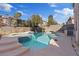 Relaxing backyard pool and spa with decorative tile and concrete surround, perfect for outdoor enjoyment at 2812 Via Avanti St, Henderson, NV 89074