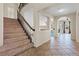 Carpeted staircase with dark railing leading to the second story at 2812 Via Avanti St, Henderson, NV 89074