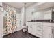 Bathroom with shower/tub, sink, and white cabinets at 2878 Via Firenze, Henderson, NV 89044