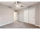 Neutral bedroom with ceiling fan and closet, featuring neutral carpet at 2878 Via Firenze, Henderson, NV 89044