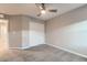 Comfortable carpeted bedroom with sliding door closet and a view into the hallway via an open door at 2878 Via Firenze, Henderson, NV 89044