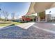 Community courtyard featuring colorful architecture, covered walkway, and stone accents at 2878 Via Firenze, Henderson, NV 89044