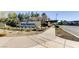 Landscaped entrance to Inspirada community with signage, shrubs, and a covered walkway at 2878 Via Firenze, Henderson, NV 89044