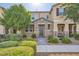 Charming two-story home with stone accents, a well-manicured yard, and a welcoming front entrance at 2878 Via Firenze, Henderson, NV 89044
