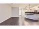 Open living area and kitchen with sleek countertops and modern appliances; perfect for entertaining guests at 2878 Via Firenze, Henderson, NV 89044
