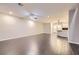 Spacious living area with wood-look tile, recessed lighting, and open views of the kitchen at 2878 Via Firenze, Henderson, NV 89044