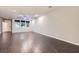 Bright and airy living room with wood-style floors and ceiling fan, perfect for comfortable living at 2878 Via Firenze, Henderson, NV 89044