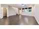 Spacious living room with wood-style flooring, access to upstairs, closet and bright windows at 2878 Via Firenze, Henderson, NV 89044